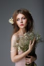 Sentimentality. Redhaired Affectionate Muse with Flowers in Dreams Royalty Free Stock Photo