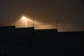 Sentry lamp above the prison in the night in the fog Royalty Free Stock Photo
