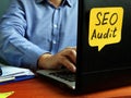 SEO audit concept. Specialist working with laptop