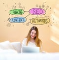 SEO concept with woman using laptop Royalty Free Stock Photo