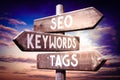 SEO, keywords, tags - wooden signpost, roadsign with three arrows