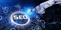 SEO Search engine optimisation digital marketing concept. 3d render robot pressing button