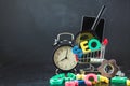 SEO Search engine optimization concept Colored letters of SEO with clock, magnifying , smartphone, gears in a basket on a black ba Royalty Free Stock Photo