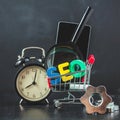 SEO Search engine optimization concept Colored letters of SEO with clock, magnifying , smartphone, gears in a basket on Royalty Free Stock Photo