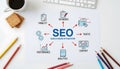SEO search engine optimization concept diagram on office desk with coffee, keyboard Royalty Free Stock Photo