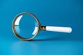 SEO search engine optimization magnifying glass on a blue background