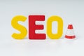 SEO, Search Engine Optimization ranking concept, alphabets abbreviation SEO with traffic cone for under construction on white Royalty Free Stock Photo
