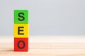 SEO Search Engine Optimization text wooden cube blocks on table background. Idea, Strategy, marketing, Keyword and Content Royalty Free Stock Photo