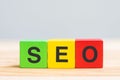 SEO Search Engine Optimization text wooden cube blocks on table background. Idea, Strategy, marketing, Keyword and Content Royalty Free Stock Photo