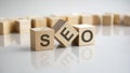 SEO - Search Engines Optimization acronym concept on cubes, gray background Royalty Free Stock Photo