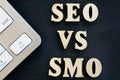 SEO vs SMO and keyboard on a dark desk Royalty Free Stock Photo