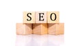 Seo word made of wooden blocks on an isolated