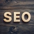 SEO word on wooden floor, search engine optimization concept