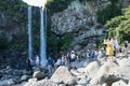 Crowds of tourists at the Jeongbang waterfall in Seogwipo, Jeju Island, South Korea Royalty Free Stock Photo