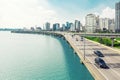 SEOUL, KOREA - AUGUST 14, 2015: Lot`s of cars passing highway road along Han river with business and residential area near by - S