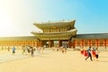 SEOUL, KOREA - AUGUST 14, 2015: Lots of people walking by Gyeongbokgung Palace - the main royal palace of the Joseon dynasty - Seo