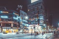 SEOUL, KOREA - AUGUST 12, 2015: Lots of young people walking by a busy main street of Sinchon district at night - Seoul, South Kor Royalty Free Stock Photo