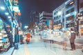 SEOUL, KOREA - AUGUST 12, 2015: Different people walking by opened stores at busy main street of Sinchon district at night - Seoul Royalty Free Stock Photo