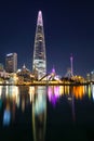 Night view of Seokchon lake, Lotte World amusement park and Lotte Tower, highest building in Korea Royalty Free Stock Photo