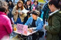 Seoul, Korea - March 7, 2015 : street artist draws a portrait caricature of a young woman at Free Market