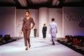 Seoul , Korea - SEPTEMBER 08 1989: A model walks the runway fashion show. Scanned from film transparency - visible grain.