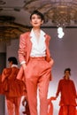 Seoul , Korea - SEPTEMBER 08 1989: A model walks the runway fashion show. Scanned from film transparency - visible grain.