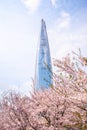 Seoul,South Korea-April 2019: Full shot of Lotte World Tower surrounded by pink cherry blossoms trees