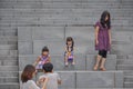 SEOUL, SOUTH KOREA - AUGUST 2012 - Ewha Womans University little girls resting on steps of Campus Complex ECC building