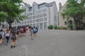 SEOUL, SOUTH KOREA - AUGUST 2012 - Group of female students walking up a hill towards Posco Building, Ewha Womans University