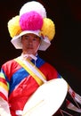 Korean drummer playing the traditional hourglass-shaped drum also known as janggu