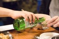 Seoul, South Korea - 1 December 2018: soju pouring from bottle into glass at the party in korea