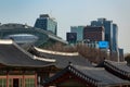 SEOUL, SOUTH KOREA - JAN 21, 2018: Deoksugung building roofs and modern Korean skyline, old and new contrast concept Royalty Free Stock Photo