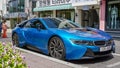 Blue car BMW i8 front view, stands by the glass wind of a shop in downtown Seoul