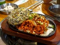 Seoul, South Korea - Jumeok-bap or rice ball and Stir-fried chicken cartilage with spicy chili pepper sauce. Royalty Free Stock Photo