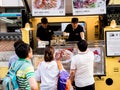 Seoul, South Korea - June 17, 2017: People queuing up at the fast food kiosk at the street near Cheonggyecheon stream in Seoul