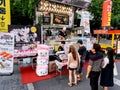 Seoul, South Korea - June 17, 2017: People queuing up at the fast food kiosk at the street near Cheonggyecheon stream in Seoul.