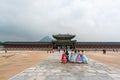 Tourists dressing in traditional Korean Hanbok while visiting Gyeongbokgung Palace, the main