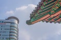 SEOUL / SOUTH KOREA - JUNE 24, 2013: Traditional temple with modern skyscraper in background - Historic culture and economic futur