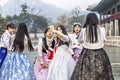 Seoul, South Korea, 12/30/2017: Korean girls in hanboks take a selfie in a winter park. Close-up