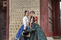 Seoul, South Korea, 12/30/2017: Korean girls in hanboks take a selfie in a winter park