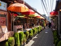 Colorful umbrellas decorating narrow street with traditional houses and shops in Ikseondong Royalty Free Stock Photo