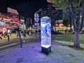 SEOUL, SOUTH KOREA - OCTOBER 26, 2022: Advertising Modern trendy light pole at night in the middle of Hong Dae area There are many