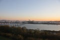 SEOUL, SOUTH KOREA - OCTOBER 24, 2022: Calm Sunset scene with bridge, buildings, and Han river in the afternoon and blue sky