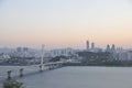 SEOUL, SOUTH KOREA - OCTOBER 24, 2022: Calm Sunset scene with bridge, buildings, and Han river in the afternoon and blue sky