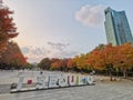 SEOUL, SOUTH KOREA - OCTOBER 27, 2022: Garden Sign with Fall maple leaves foliage in Seoul Forest park