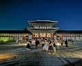 SEOUL, SOUTH KOREA - OCTOBER 23, 2022: Light up of Gyeongbokgung Palace main hall at night. There are many tourists wear