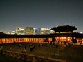 SEOUL, SOUTH KOREA - OCTOBER 23, 2022: Light up of Gyeongbokgung Palace main hall at night. There are many tourists wear