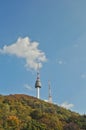 SEOUL, SOUTH KOREA - OCTOBER 23, 2022 N Seoul Tourist Sigthseeing tall tower above Namsan mountain hill and blue sky with Autumn Royalty Free Stock Photo