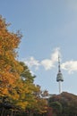 SEOUL, SOUTH KOREA - OCTOBER 23, 2022 N Seoul Tourist Sigthseeing tall tower above Namsan mountain hill and blue sky with Autumn Royalty Free Stock Photo