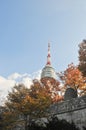 SEOUL, SOUTH KOREA - OCTOBER 23, 2022 N Seoul Tourist Sigthseeing tall tower above Namsan mountain hill and blue sky with Autumn Royalty Free Stock Photo